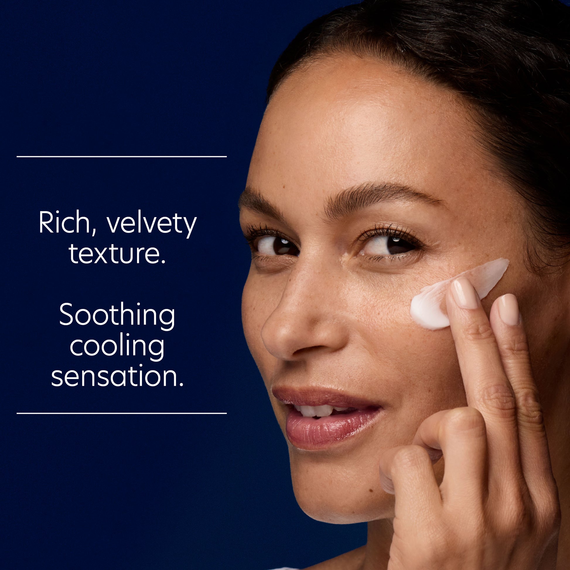 Woman applying cream to her face with a blue background and text about product texture and sensation.