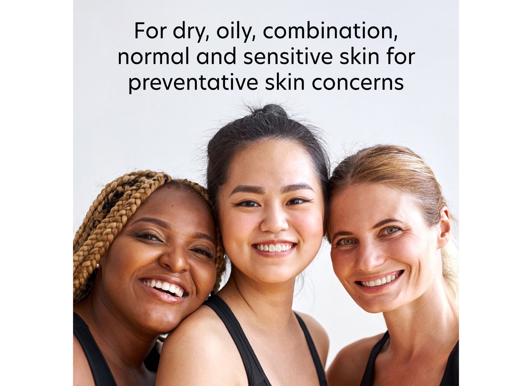 Three women with different skin tones smiling together, with text about skin types and concerns.